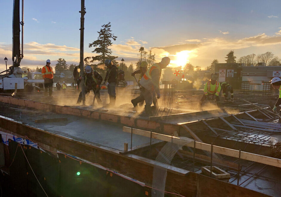 Concrete crew pouring the suspended slab at Watermark Apartments